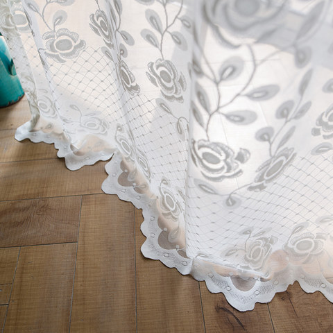 Net curtain with a scalloped edge Net curtain with a scalloped edge
